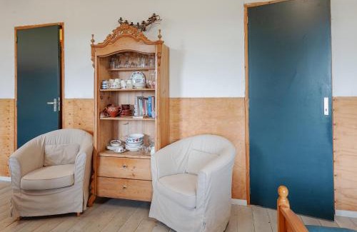 Burum Apartment | Farmhouse by Lauwers River with Rowing Boat