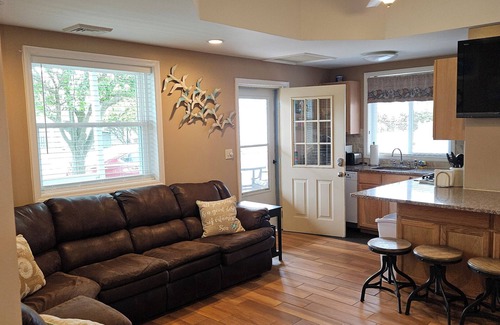 Wildwood Crest Condo | FEEL THE OCEAN BREEZE ON THE LARGE PORCH WHILE ENJOYING YOUR FAVORITE BEVERAGE