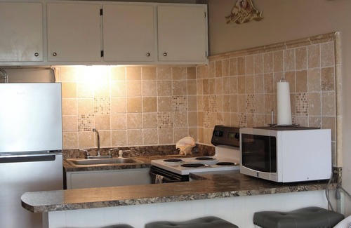 Stella Condo | Feet away from famous Villa Cofresi Hotel, Tiki Bar, Restaurants, Water-sports.