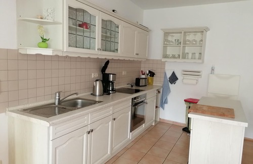 Riemserort House | First floor apartment by the water with terrace, carport parking space and WLAN