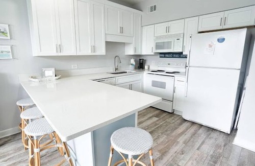 Gulf Place Condo | First floor condo overlooking the heated pool. Steps from the private beach!