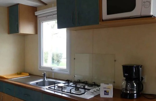 Saint Nazaire sur Charente House | Flower Camping L'Abri-Côtier * - Mobilehome Smally 21m2 STANDARD - 2 bedrooms + covered terrace (without TV) 4 people