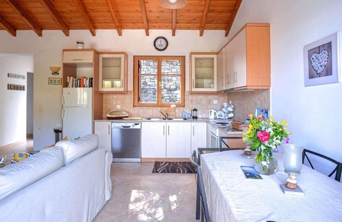 Longos House | From its elevated position directly above Levrecchio beach, this wonderfully light and airy villa en