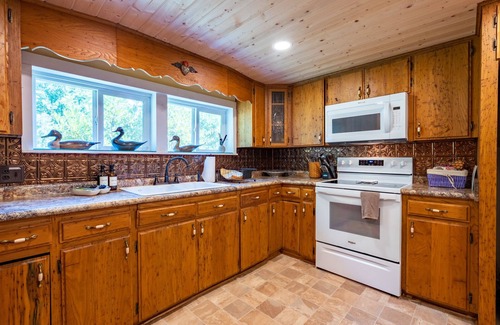 Almond Cabin | Front porch with bed swing, Pets Welcome, Hot Tub, Fireplace, Creek, Firepit.