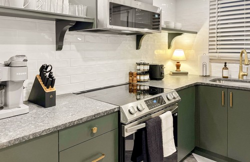 Grandview Heights Condo | Garden Suite - Sauna + King Bed! -Central location