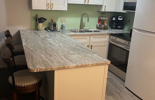 Emerald Isle Condo | Gated community with Indoor and Outdoor Pools.Walk to dining and fun!