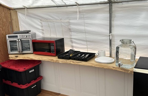 Big Arm RV Rental | GlampCamp - Luxury Wall Tent & Bathhouse