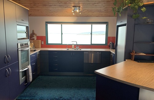 Onerahi Apartment | Harbour views from super spacious upstairs apartment. Fully equipped.