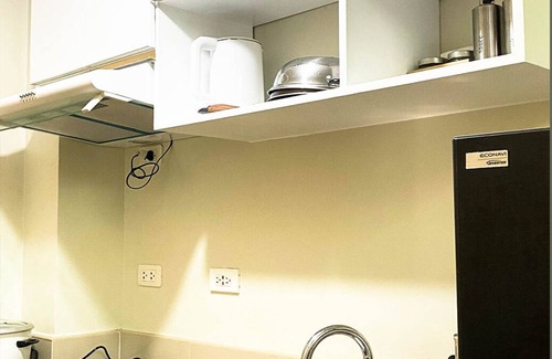 San Bartolome Condo | Heart of the city with the best staycation spot in town with pool access!