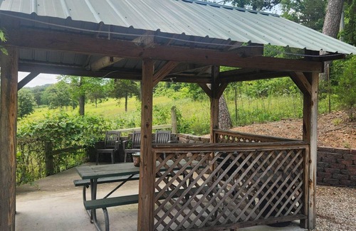 Eminence Cottage | Hogan's Hideout Duplex #20 Jacuzzi Room is a relaxing, cozy room