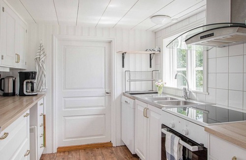 Granna Ski Chalet | Holiday home on a lake property with a own bathing area, jetty and sauna