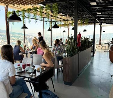 Quito House | Hostal La Terraza - Roof Terrace Overlooking The North and Historic Centre
