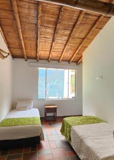 Zetaquira Hotel | Hotel y termales Las Heliconias