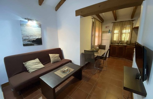El Palmar House | House/bungalow in tourist complex with private garden and shared pool