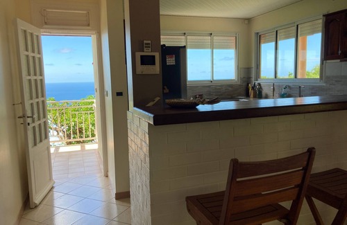 Les Anses-d'Arlets Villa | House with swimming pool with sea view in a garden with trees in Anses d'Arlet