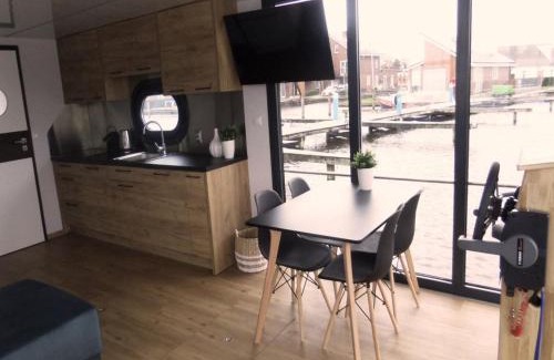 Municipality of Uitgeest Boat Rental | Houseboat at Marina with Lake Views