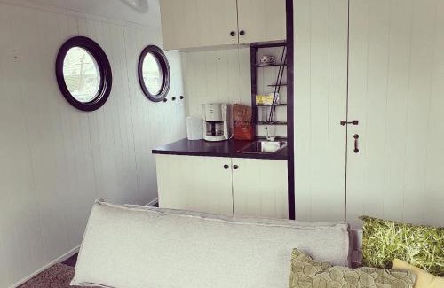 Lathum Boat Rental | Houseboat in Lathumse Plas with Harbor Views