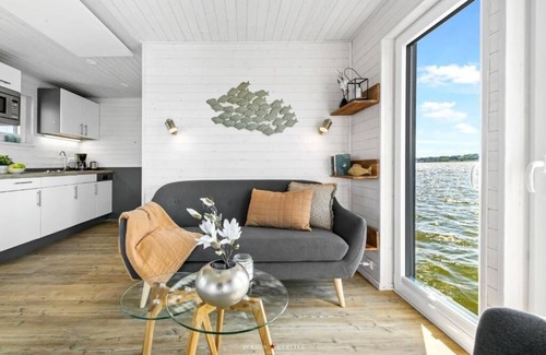 Schleswig Boat Rental | Houseboat moments of happiness for 4 people with roof terrace on the Baltic Sea fjord Schlei