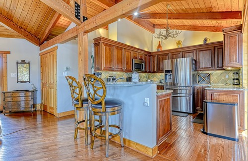 Louisa House | Huge lakefront home with A/C, sunroom, boat ramp, WIFI,game room, deck, & kayaks