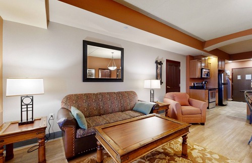 Lyndon Station Condo | Ideally located condo with fireplace, jetted tub, on-site golf, & central AC