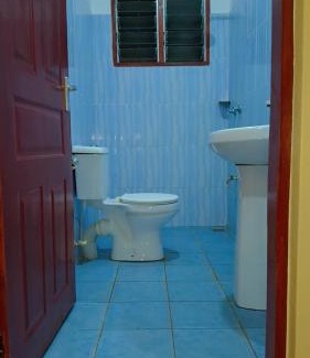 Manyimbo House | Indian ocean apartments you get the master bedroom with the private bathroom and the host sleeps in the other bedroom you share kitchen anc living room