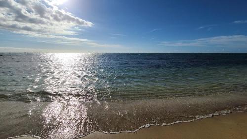 Guanajibo House | Joyuda Beachfront Condo with Private Balcony