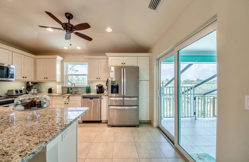 Beachview Country Club Estates House | Key West appeal & gorgeous Sanibel River views& bicycles -Villa Calypso Tides- Roelens Vacations