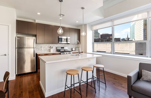 Central Business District Apartment | Kislak 507 Stunning 2BR with Den Corner Apt Retreat Above the City