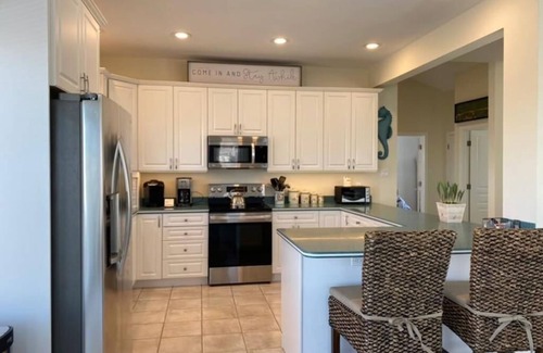 Loveladies House | Lagoon front. Loveladies. Dock. Decks. Beach Badges. Bikes. Ping Pong table.