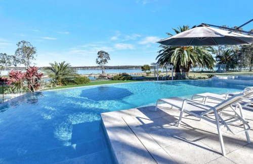 Dora Creek House | Lake Palm Resort Luxury Retreat absolute Waterfront on 3 acres at Lake Macquarie.