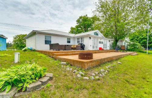 Gladwin House | Lakefront Gladwin Vacation Rental with Deck and Dock!