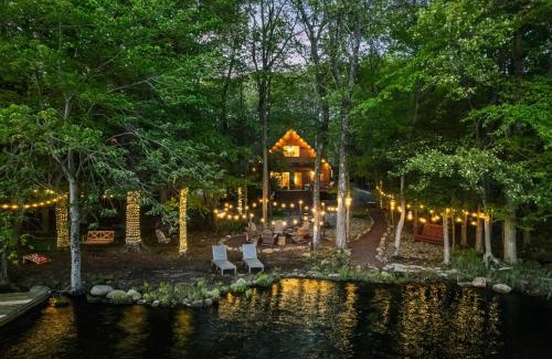 Pocono Summit Ski Chalet | Lakehouse with Boats, MiniGolf, Sauna, HotTub, Swings and Playground!