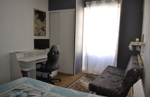 Chef-Boutonne Bed & Breakfast | Large guest room with bed and sofa bed