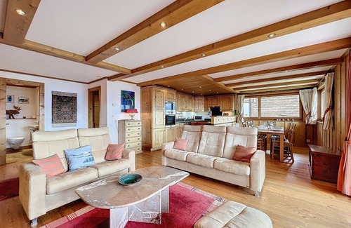 Verbier Apartment | Living room with Swedish fireplace, open kitchen with vitroceram, dishwasher, Nespresso machine and