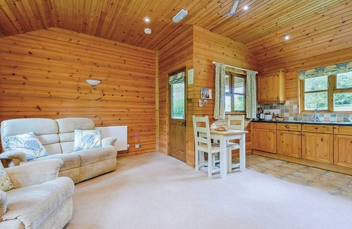 Kilcot Ski Chalet | Lodge with one king-size double with en suite bathroom with shower.