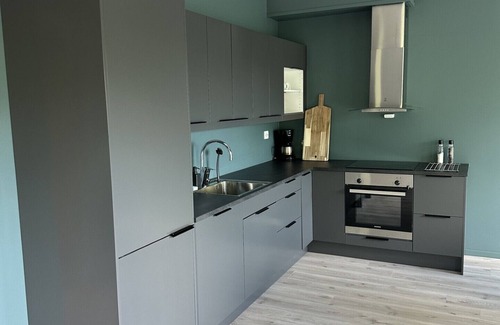 Loen Apartment | Loen Panorama in Stryn, outdoor hot tub with fjord and mountain views