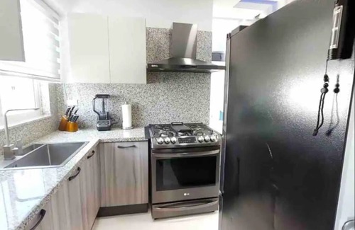 Ensanche Quisqueya House | Luxurious 2BR condo with Rooftop, jacuzzi and BBQ