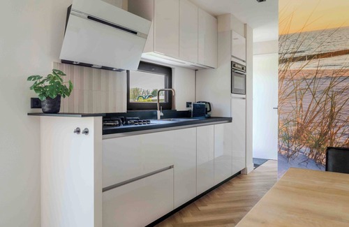 Sint Kruis Ski Chalet | Luxurious 5-person chalet in Zeeuws-Vlaanderen - Large garden - Air conditioning