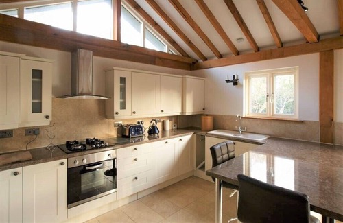 Stoke Ash House | Luxury barn with private hot tub, sauna, pizza oven, dog friendly.