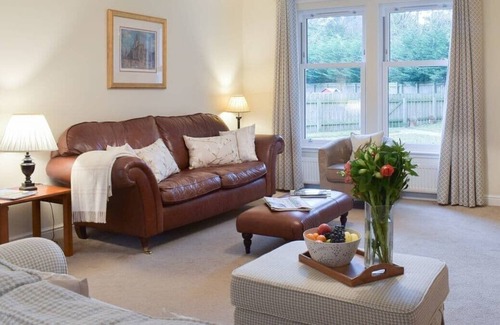 Carberry Cabin | Luxury lodge, set in 40 acres of beautiful private gardens at Carberry Tower Estate.