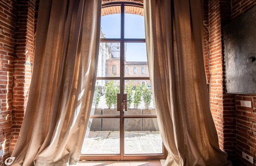 Lucca Historical Center House | Medieval Tower House alongside the Cathedral San Martino Bell Tower built 1204.