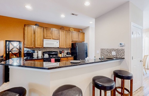 Millville House | Millville by the Sea three-story home with resort amenities & screened patio