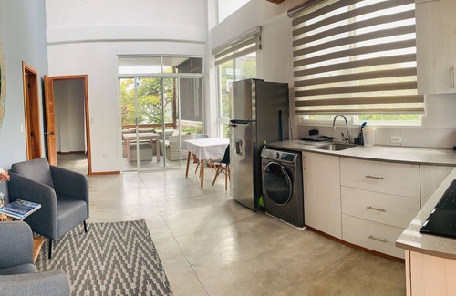 Bahia de la Academia Apartment | Modern apartment with 18 feet ceilings and private terrace with view to a park