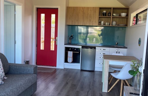 Castlepoint Apartment | Modern apartment with stunning views of Lighthouse and short walk to beach.