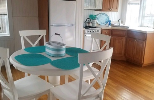 West Yarmouth Condo | Modern beachfront cottage newly renovated steps from warmest beach!