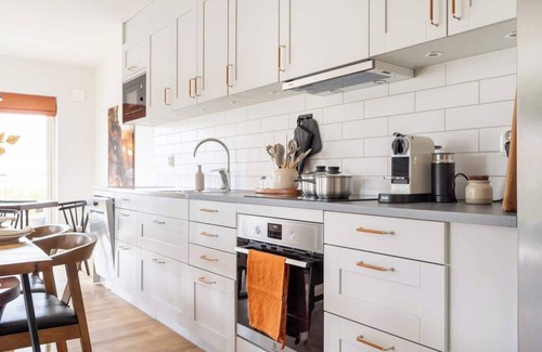 Bastad Condo | Modern Ground Floor Corner Flat with Rustic Patio