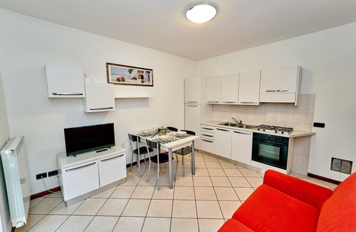 Curno Apartment | Modern one-bedroom apartment near the hospital, with large garden and equipped with washing machine