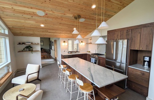 Hamma Hamma House | Modern retreat with serene canal, forest, and mountain views.