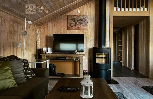 Ringsaker House | Modern sports cabin on Sjusjøen with sauna and waxing room