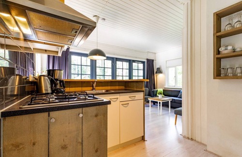 Norg House | Monumental 4-person bungalow, built under the architecture of the Amsterdam School with unique details.